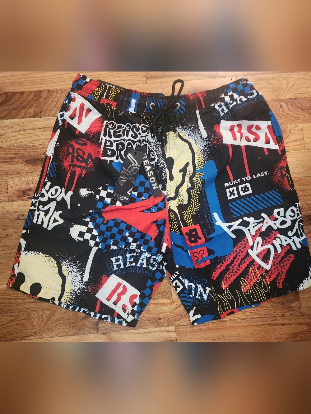 Reason Black Graphic Swim Trunks with Red, Blue & Yellow Accents